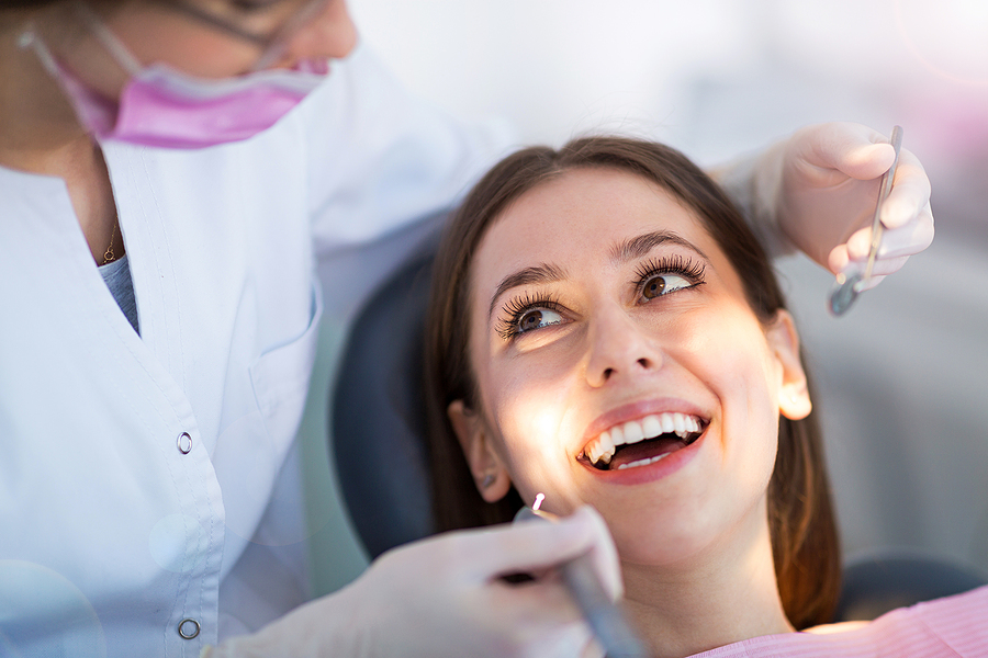 Dentist and patient in dentist office