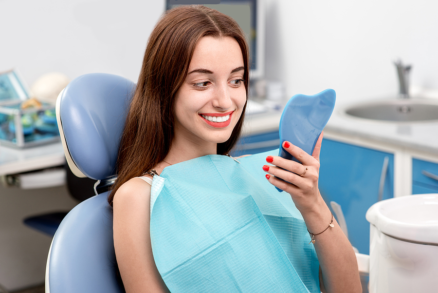 Young woman patient visiting dentist in the dental office