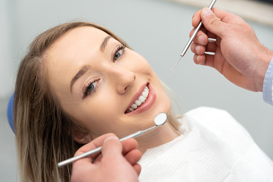 Woman Having Teeth Examined At Dentists. Teeth Whitening, Dental